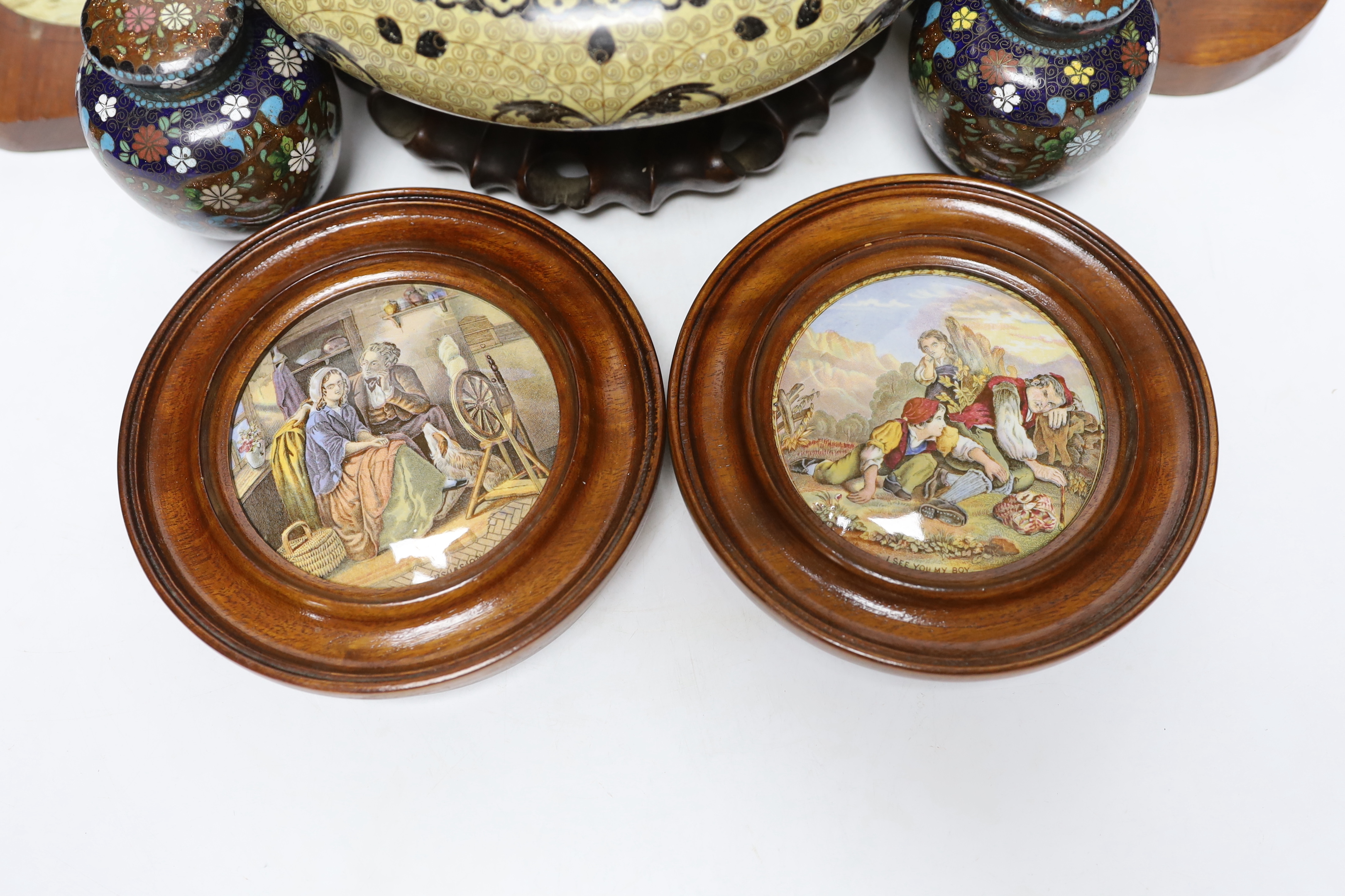 A Chinese cloisonné enamel bowl on a wooden stand, a pair of cloisonné jars with covers, and four 19th century Prattware pot lids, largest 25cm in diameter